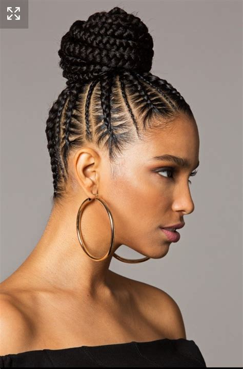 Most might opt for a low-placed bun, but if you really want to stand out, braid your hair into an elaborate topknot. . Updo braided bun hairstyles for black hair